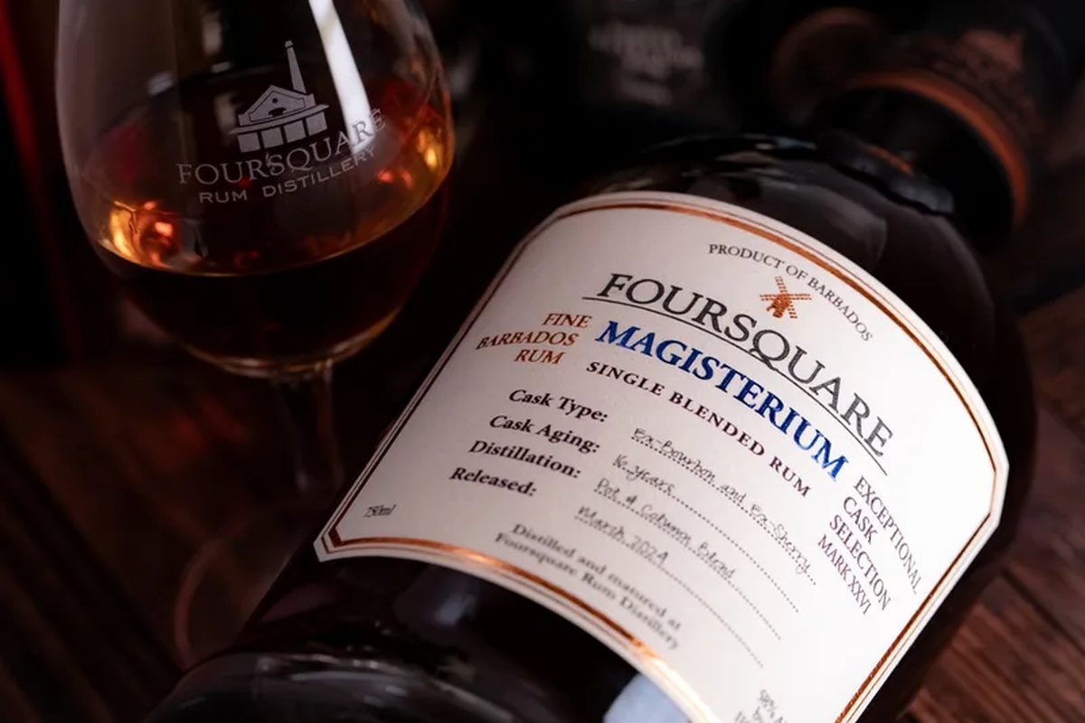 Bottle of Foursquare Magisterium Barbados rum beside a tasting glass