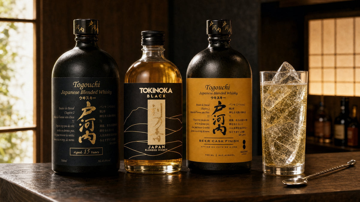 Togouchi 15 Years, Tokinoka Black and Togouchi Beer Cask Finish on a timber bar beside a Japanese whisky highball